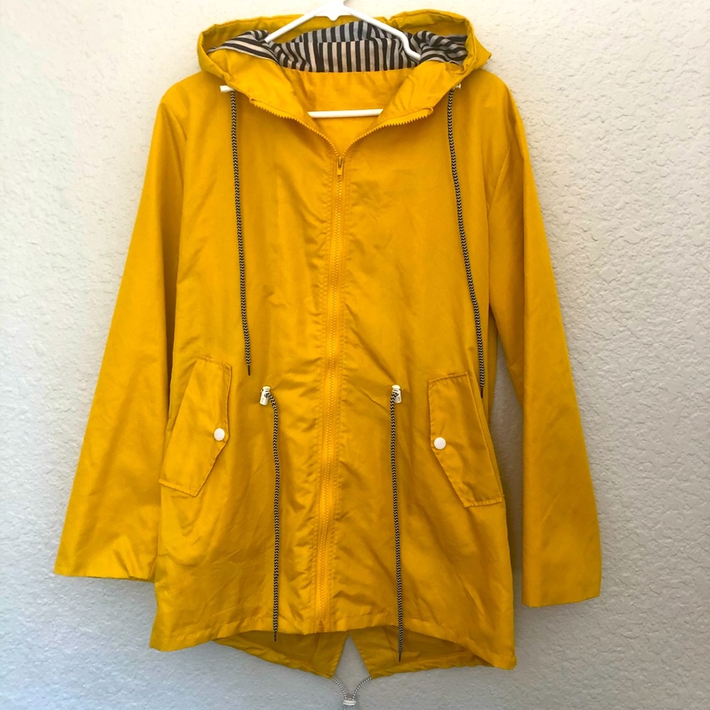 Yellow rain coat with black and white striped details in hood 2XL